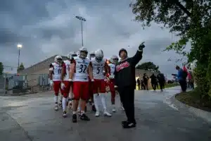 Westside Higih School head coach Paul Limongi leads his team to the field before a game between the Millard South and Omaha Westside in Omaha, NE on Sunday October 13tth, 2023. Photo by Eric Francis