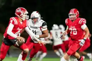 Westside High School defensive lineman Rj Eckhardt (11) runs after Millard South’s Jett Thomalla during a game between the Millard South and Omaha Westside in Omaha, NE on Sunday October 13th, 2023. Photo by Eric Francis