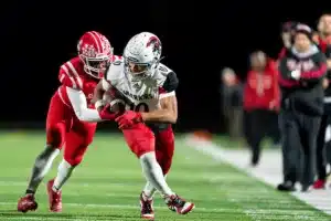 Westside High School Keynan Cotton (10) tries to break free of the defender during a game between the Millard South and Omaha Westside in Omaha, NE on Sunday October 13th, 2023. Photo by Eric Francis