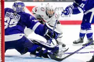 The puck slips by Niagara goaltender Ryan Ouellette
