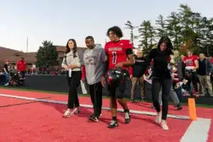 Westside High School Caleb Benning (1) and parents on senior night before a game between Lincoln North East and Westside in Omaha, NE on Thursday October 19tth, 2023. Photo by Eric Francis