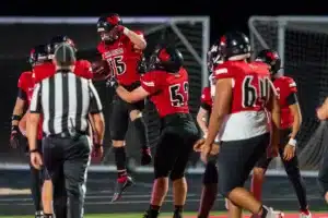 Westside High School Finn Christensen (15) celebrates a touchdown during a game between Lincoln North East and Westside in Omaha, NE on Thursday October 19tth, 2023. Photo by Eric Francis