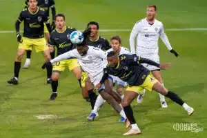 Union defender Marco Milanese fights for a header during a play off game between the Charlotte and Omahai Omaha, NE on Saturday October 28th, 2023. . Photo by Eric Francis