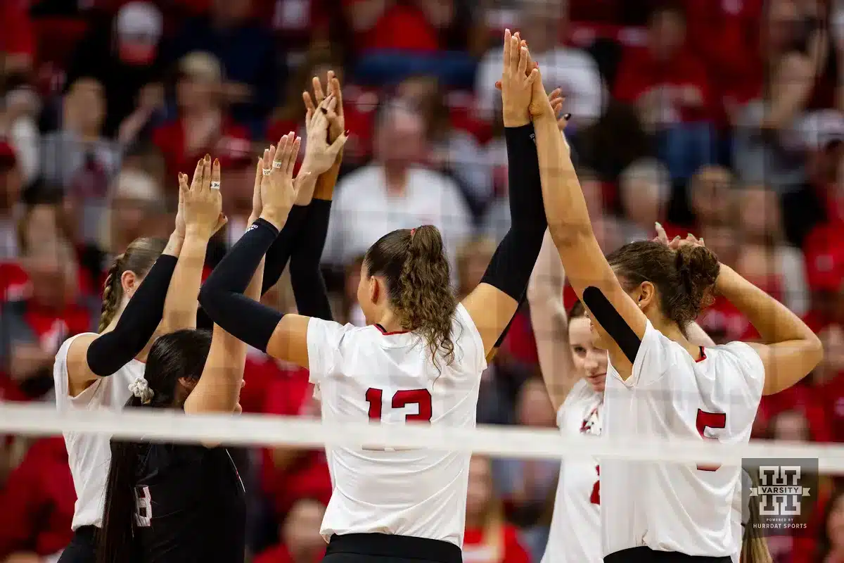 Nebraska Cornhusker huddle up before the start of the match against the Illinois Fighting Illini during the volleyball match on Sunday, November 12, 2023, in Lincoln, Nebraska. Photo by John S. Peterson.