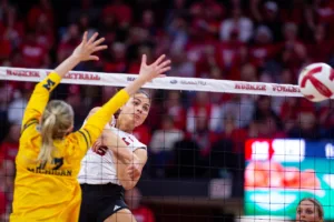 Nebraska Cornhusker Bekka Allick (5) spkes the ball past Michigan Wolverine Jacque Boney (17) in the first set during the volleyball match on Friday, November 17, 2023, in Lincoln, Nebraska. Photo by John S. Peterson.