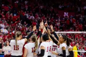 Nebraska Cornhuskers celebrate their win over the Michigan Wolverines in thrre sets during the volleyball match on Friday, November 17, 2023, in Lincoln, Nebraska. Photo by John S. Peterson.