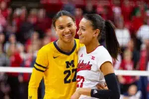 Sisters Nebraska Cornhusker Harper Murray (27) and Michigan Wolverine Kendall Murray (27) pose for a photo after the volleyball match on Friday, November 17, 2023, in Lincoln, Nebraska. Photo by John S. Peterson.