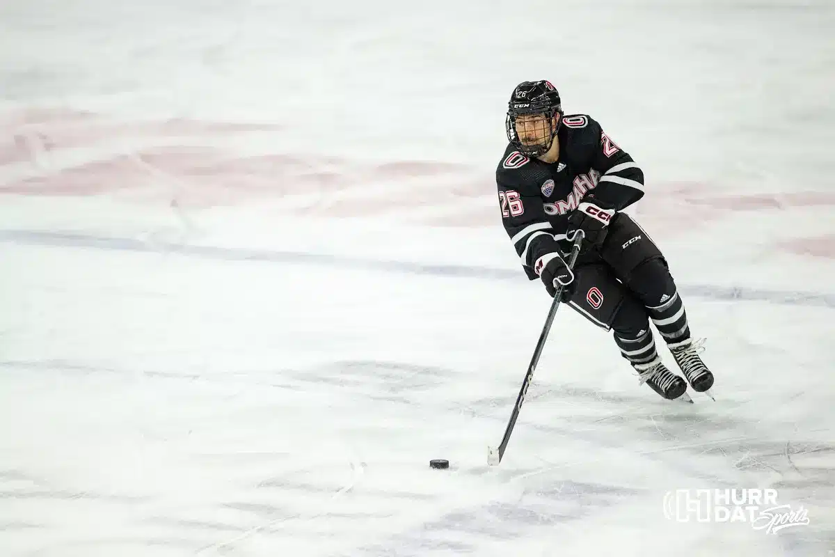 Omaha Maverick forward Brock Bremer (26) skates with the puck against the Augustana Vikings in the second period during the hockey match on Saturday, November 25, 2023, in Lincoln, Neb. Photo by John S. Peterson.