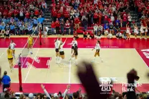 Nebraska Cornhuskers celebrate their win over the Long Island Sharks in three sets during the first round of the NCAA volleyball championships on Friday, December 1, 2023, in Lincoln, Neb. Photo by John S. Peterson.