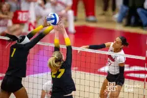 Nebraska Cornhusker Harper Murray (27) spikes the ball against Missouri Tiger Sierra Dudley (27) and Colleen Finney (1) in the third set during the second round of the NCAA volleyball championships on Saturday, December 2, 2023, in Lincoln, Neb. Photo by John S. Peterson.