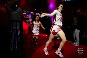 Nebraska Cornhuskers Kendall Moriarty (15) and Callin Hake run out to the court to take on the UNC Wilmington Seahawks during a college basketball game Tuesday, December 5, 2023, in Lincoln, Neb. Photo by John S. Peterson.