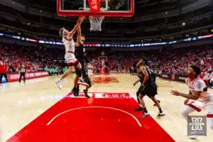 Nebraska Cornhusker guard Sam Hoiberg (1) makes a layup against Michigan State Spartan forward Malik Hall (25) in the second half during the college basketball game Sunday, December 10, 2023, Lincoln, Neb. Photo by John S. Peterson.