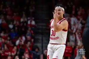 Nebraska Cornhusker guard Keisei Tominaga (30) holds his hand in front of his face after making a three against the Michigan State Spartans in the second half during the college basketball game Sunday, December 10, 2023, Lincoln, Neb. Photo by John S. Peterson.