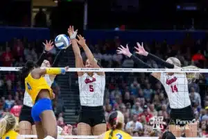 Nebraska Cornhusker outside hitter Merritt Beason (13), middle blocker Bekka Allick (5), and outside hitter Ally Batenhorst (14) blocka spike from Pittsburgh Panther outside hitter Torrey Stafford (4) in the second during the NCAA Semi-Finals, Thursday, December 14, 2023, Tampa, Florida. Photo by John S. Peterson.