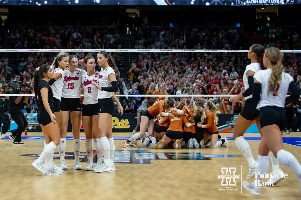 Nebraska Cornhuskers come together after Texas won match point in three sets during the NCAA Finals on Sunday, December 17, 2023, in Tampa, Florida. Photo by John S. Peterson.