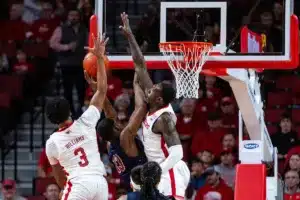 Nebraska Cornhusker guard Brice Williams (3) and Juwan Gary block South Carolina State Bulldog center Drayton Jones (13) in the first half during a college basketball game on Friday, December 29, 2023, in Lincoln, Nebraska. Photo by John S. Peterson.