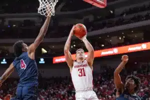 Nebraska Cornhusker guard Cale Jacobsen (31) makes a layup against South Carolina State Bulldog forward Caleb McCarty (4) int he second half during a college basketball game on Friday, December 29, 2023, in Lincoln, Nebraska. Photo by John S. Peterson.