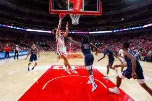 Nebraska Cornhusker forward Josiah Allick (53) makes a layup against South Carolina State Bulldog guard Mitchel Taylor (12) in the second half during a college basketball game on Friday, December 29, 2023, in Lincoln, Nebraska. Photo by John S. Peterson.