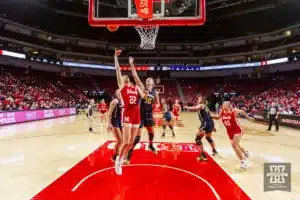 Nebraska Cornhusker forward Natalie Potts (22) makes a lay up against Michigan Wolverine guard Jordan Hobbs (10) in the second half during a college basketball game on Wednesday, January 17, 2024, in Lincoln, Nebraska. Photo by John S. Peterson.