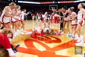 Nebraska Cornhusker guard Kendall Moriarty (15) and  guard Logan Nissley (2) do the worm celebrating the win over the Maryland Terrapins during a college basketball game on Sunday, December 31, 2023, in Lincoln, Nebraska. Photo by John S. Peterson.