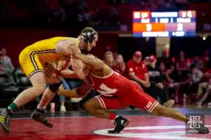 Nebraska Cornhusker Elise Brown Tone shoots for a leg against Wyoming Cowboy Tyce Raddon during a college wrestling match on Saturday, January 6, 2024, in Lincoln, Nebraska. Photo by John S. Peterson.