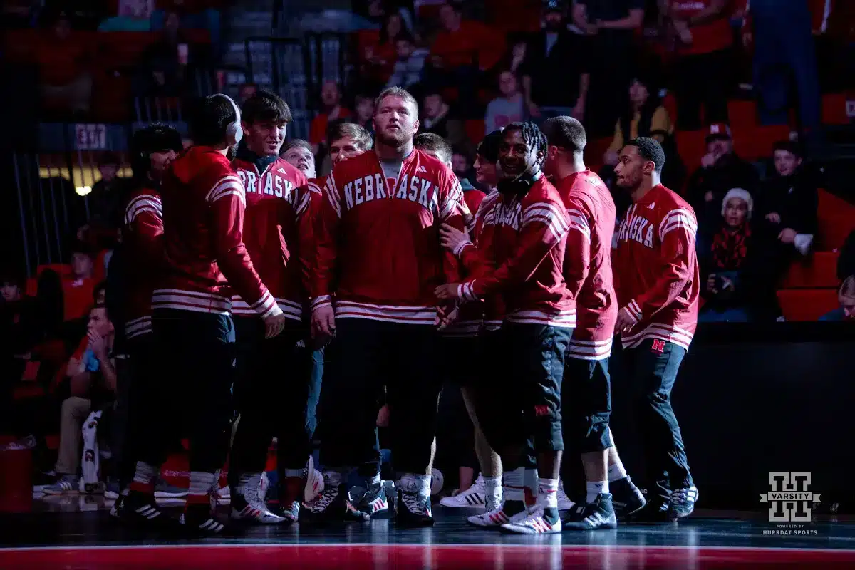 Nebraska Cornhusker Nash Hutmacher, middle, waiting to be introduce with Harley Andrews before the start of the Wyoming dual during a college wrestling match on Saturday, January 6, 2024, in Lincoln, Nebraska. Photo by John S. Peterson.