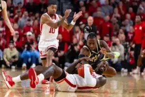 Nebraska Cornhusker forward Juwan Gary (4) grabs the loose ball against Purdue Boilermaker guard Lance Jones (55) in the first half during a college basketball game on January 9, 2024, in Lincoln, Nebraska. Photo by John S. Peterson.