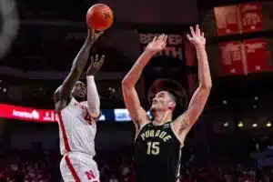 Nebraska Cornhusker forward Juwan Gary (4) makes a basket against Purdue Boilermaker center Zach Edey (15) in the first half during a college basketball game on January 9, 2024, in Lincoln, Nebraska. Photo by John S. Peterson.