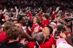 Nebraska Cornhusker forward Juwan Gary (4) celebrates the win over the Purdue Boilermakers with all the fans on the court during a college basketball game on January 9, 2024, in Lincoln, Nebraska. Photo by John S. Peterson.