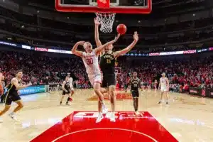 Nebraska Cornhusker guard Keisei Tominaga (30) goes for a lay up against Purdue Boilermaker center Zach Edey (15) in the second half during a college basketball game on January 9, 2024, in Lincoln, Nebraska. Photo by John S. Peterson.