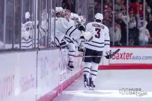 Omaha defenseman Kirby Proctor (3) gets high fives from his teammates after scoring a goal against Minn. Duluth in the first period during a college hockey match on Friday, February 2, 2024, in Omaha, Nebraska. Photo by John S. Peterson.