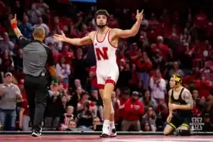 149: Nebraska Cornhusker No. 1 Ridge Lovett (19-0) celebrates a win over Michigan Wolverine No. 6 Austin Gomez (5-0) during a college wrestling match on Friday, February 9, 2024, in Lincoln, Nebraska. Photo by John S. Peterson.