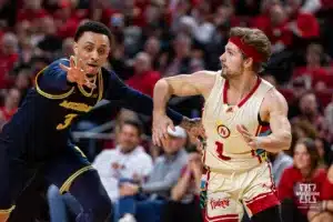 Nebraska Cornhusker guard Sam Hoiberg (1) scrambles to get open for a pass against Michigan Wolverine guard Jaelin Llewellyn (3) in the second half during a college basketball game on Saturday, February 10, 2024, in Lincoln, Nebraska. Photo by John S. Peterson.