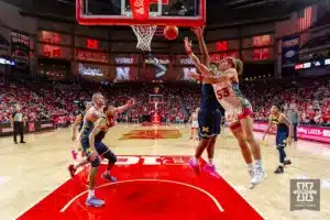 Nebraska Cornhusker forward Josiah Allick (53) makes a lay up against Michigan Wolverine forward Tarris Reed Jr. (32) in the first half during a college basketball game on Saturday, February 10, 2024, in Lincoln, Nebraska. Photo by John S. Peterson.