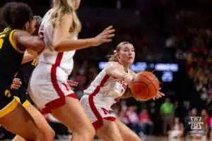 Nebraska Cornhusker guard Logan Nissley (2) makes a pass in the second quarter against the Iowa Hawkeyes during a college basketball game on Sunday, February 11, 2024, in Lincoln, Nebraska. Photo by John S. Peterson.