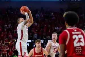 Nebraska Cornhusker guard C.J. Wilcher (0) makes a three point shot against the Wisconsin Badgers in the second half during a college basketball game on Thursday, February 1, 2024, in Lincoln, Nebraska. Photo by John S. Peterson.