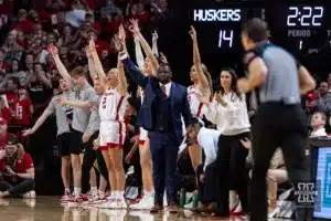 Nebraska Cornhusker bench celebrates three point shot against the Minnesota Golden Gophers in the first half during a college basketball game Saturday, February 24, 2024, in Lincoln, Neb. Photo by John S. Peterson.