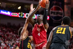 Nebraska Cornhusker forward Juwan Gary (4) makes a lay up against Minnesota Golden Gopher guard Cam Christie (24) in the first half during a college basketball game Sunday, February 25, 2024, in Lincoln, Neb. Photo by John S. Peterson.