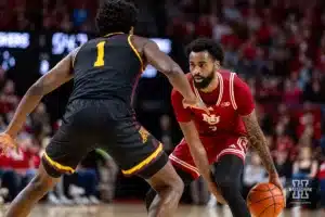 Nebraska Cornhusker guard Brice Williams (3) dribbles the ball against Minnesota Golden Gopher forward Joshua Ola-Joseph (1) in the first half during a college basketball game Sunday, February 25, 2024, in Lincoln, Neb. Photo by John S. Peterson.