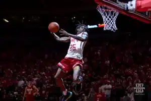 Nebraska Cornhusker football player Jeremiah Charles (25) performs in the halftime dunk contest during a college basketball game against the Minnesota Golden Gophers Sunday, February 25, 2024, in Lincoln, Neb. Photo by John S. Peterson.