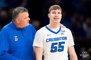 Creighton Bluejays head coach Greg McDermott talk to Creighton Bluejays guard Baylor Scheierman