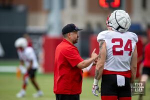 Nebraska Cornhusker head coach Matt Rhule talks to Thomas Fidone II during football practice Friday, August 9, 2024, in Lincoln, Nebraska. Photo John S. Peterson.