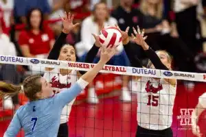 Nebraska Cornhuskers Merritt Beason (13) and Andi Jackson blocks a shot from Texas A&M CC Islander Leah Stolfus (7) during the college volleyball game Friday, August 30, 2024, in Lincoln, Nebraska. Photo John S. Peterson.