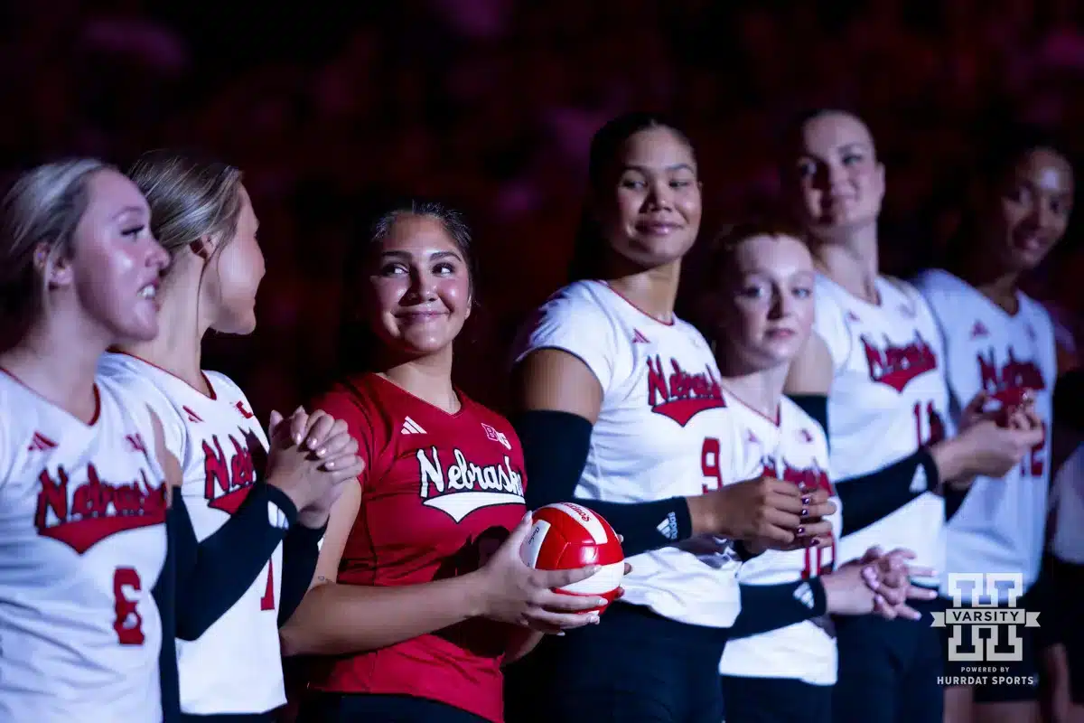 Nebraska Cornhusker Lexi Rodriguez (8) is all smiles when introduced before taking on Texas A&M CC Islanders during the college volleyball game Friday, August 30, 2024, in Lincoln, Nebraska. Photo John S. Peterson.