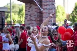 Nebraska Cornhusker baton twirler entertains the fans waitng for the Huskers to arrive to take on Illinois Fighting Illini during a college football game Firiday, September 20, 2024, in Lincoln, Nebraska. Photo by John S. Peterson.