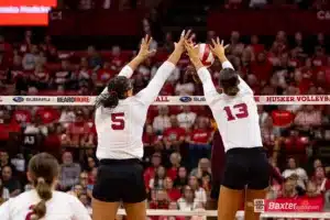 Nebraska Cornhusker Merritt Beason (13) and Rebekah Allick blocks the ball against the Arizona State Sundevils in the first set during the college volleyball match Friday, September 13, 2024, in Lincoln, Nebraska. Photo John S. Peterson.