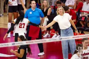 Nebraska Cornhusker assistant coach Jordan Larson gives Harper Murray five in the third set against the Stanford Cardinal during a college volleyball match Wednesday, September 18, 2024, in Lincoln, Nebraska. Photo by John S. Peterson.