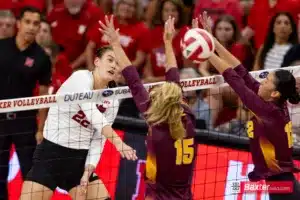 Nebraska Cornhusker Lindsay Krause (22) spikes the ball against Arizona State Sundevil middle blocker Savannah Kjolhede (15) and Argentina Ung in the third set during the college volleyball match Friday, September 13, 2024, in Lincoln, Nebraska. Photo John S. Peterson.