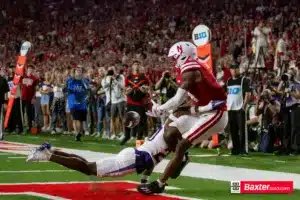 Nebraska Cornhusker wide receiver Jahmal Banks (4) reaches for the ball when hit by Northern Iowa Panther defensive back Keith Moko (20) during the college football game Saturday, September 14, 2024, in Lincoln, Nebraska. Photo John S. Peterson.