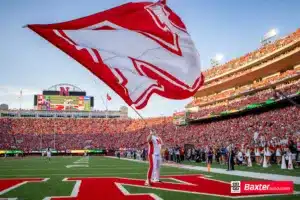 Nebraska Cornhusker Spirit Squad member waves a flag during the college football game Saturday, September 14, 2024, in Lincoln, Nebraska. Photo John S. Peterson.